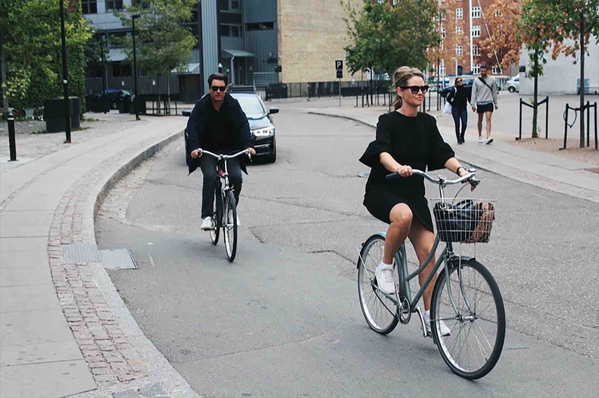 Image of 2 people cycling bikes